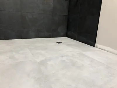 Large Format Black Shower Walls w/ Light Floor Tile 1
