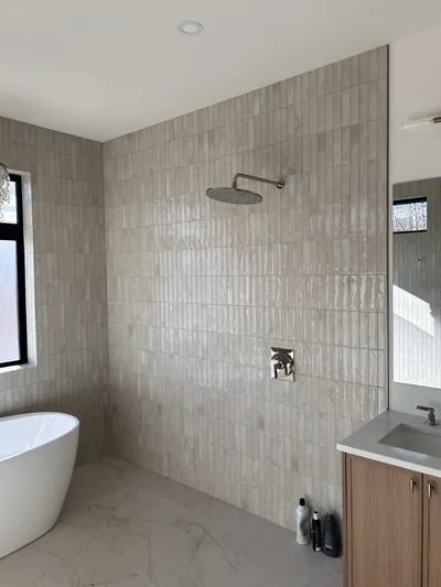 Small Vertical Pattern Custom Curbless Wet Room Shower with Epoxy Mitre Detail 2
