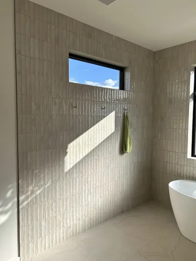 Small Vertical Pattern Custom Curbless Wet Room Shower with Epoxy Mitre Detail 3