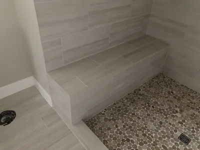 Custom Shower w/ Bench and Pebble Floor Features 1