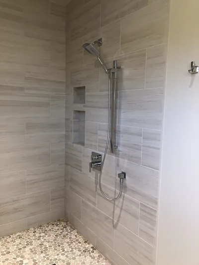 Custom Shower w/ Bench and Pebble Floor Features 2