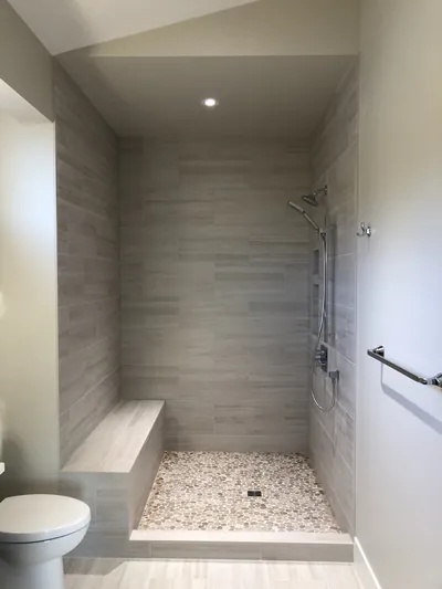 Custom Shower w/ Bench and Pebble Floor Features 4