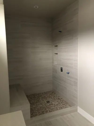Custom Shower w/ Bench and Pebble Floor Features 6
