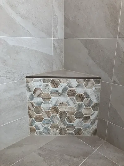 Custom Shower w/ Linear Drain, Corner Bench, and Feature Band Details 3