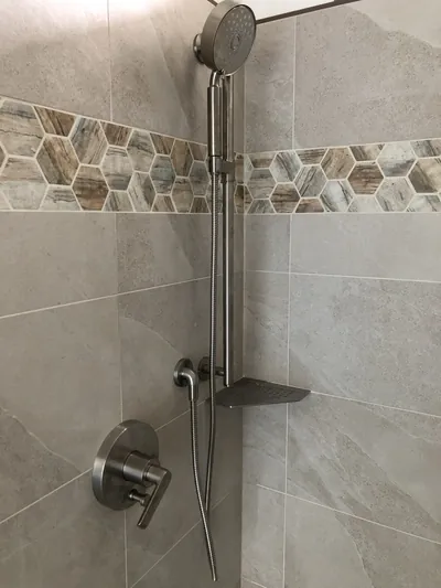 Custom Shower w/ Linear Drain, Corner Bench, and Feature Band Details 4