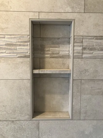 Custom Shower w/ Pebble Floor, Bench, Niche, and Feature Band Details 1