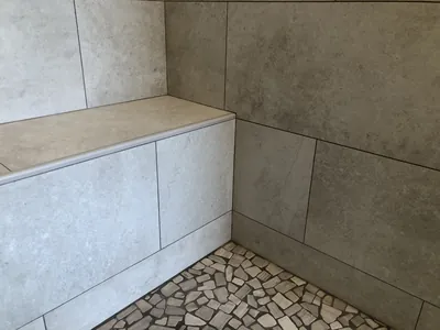 Custom Shower w/ Pebble Floor, Bench, Niche, and Feature Band Details 3