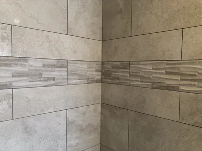 Custom Shower w/ Pebble Floor, Bench, Niche, and Feature Band Details 4