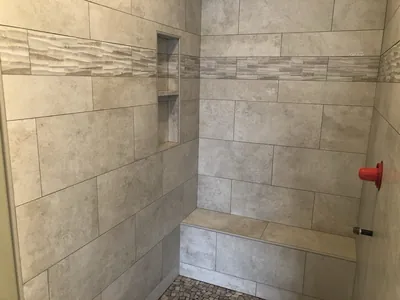 Custom Shower w/ Pebble Floor, Bench, Niche, and Feature Band Details 8