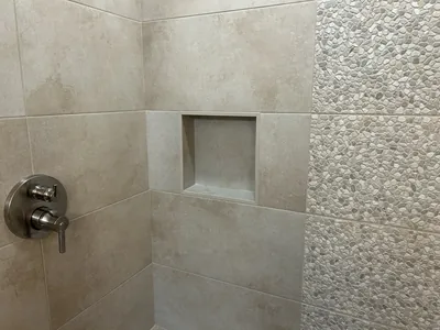 Custom Tile Shower w/ Bench, Pony Wall, Niche, and Feature Band Details 3