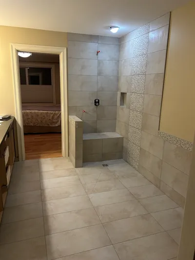 Custom Tile Shower w/ Bench, Pony Wall, Niche, and Feature Band Details 6