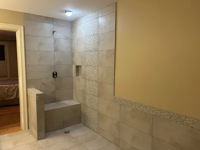 Custom Tile Shower w/ Bench, Pony Wall, Niche, and Feature Band Details 7