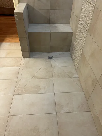 Custom Tile Shower w/ Bench, Pony Wall, Niche, and Feature Band Details 9