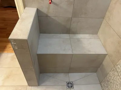 Custom Tile Shower w/ Bench, Pony Wall, Niche, and Feature Band Details 11