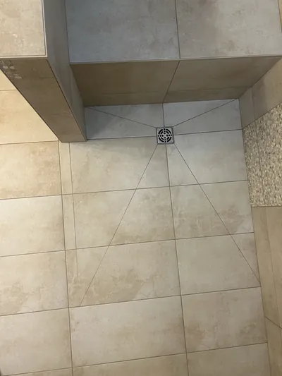 Custom Tile Shower w/ Bench, Pony Wall, Niche, and Feature Band Details 14