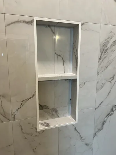 Custom Tile Shower w/ Herringbone Floor and Niche Details 1