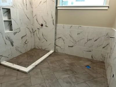 Custom Tile Shower w/ Herringbone Floor and Niche Details 3