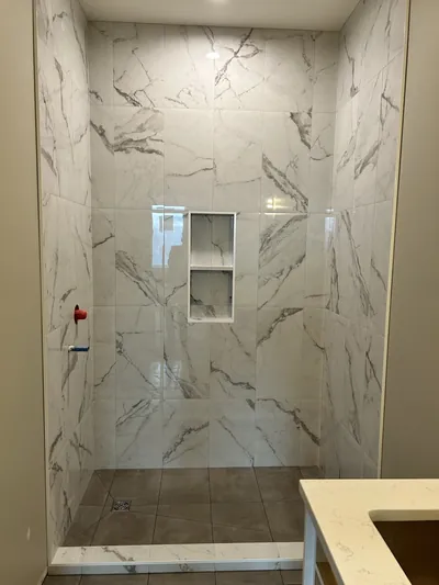 Custom Tile Shower w/ Wall Coloured Tile Curb 4