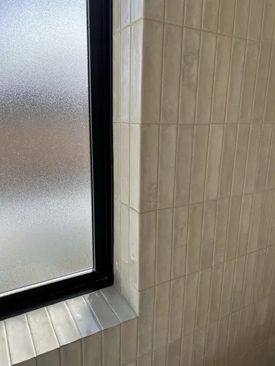 Small Vertical Pattern Custom Curbless Wet Room Shower with Epoxy Mitre Detail 5