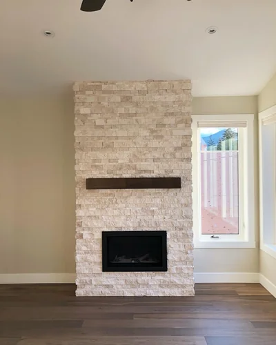 Floor-to-ceiling stone fireplace