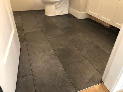 Dark large-format tile floor