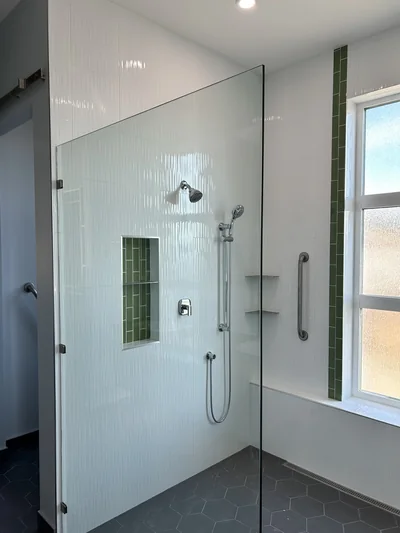 Custom shower with green accent tile