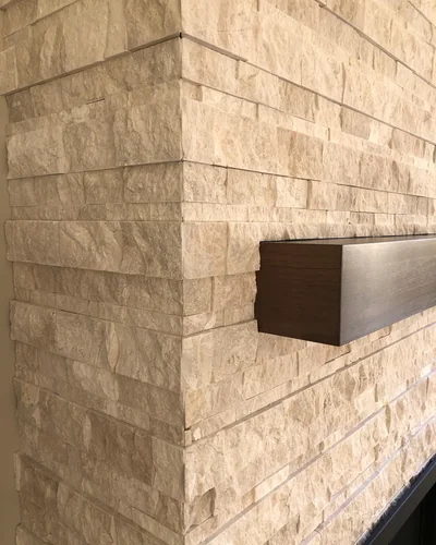 Floor-to-ceiling stone fireplace