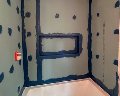 The same shower niche built in half-inch UberBoard with every seam and corner sealed