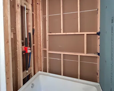 Shower niche and tub surround framed and blocked before UberBoard goes on
